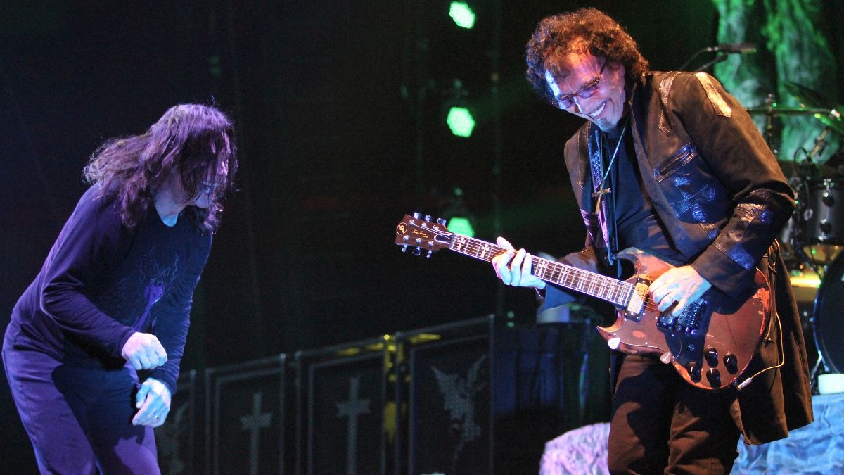 Singer Ozzy Osbourne and guitarist Tony Iommi are shown performing on stage during a live concert appearance on August 8, 2013.