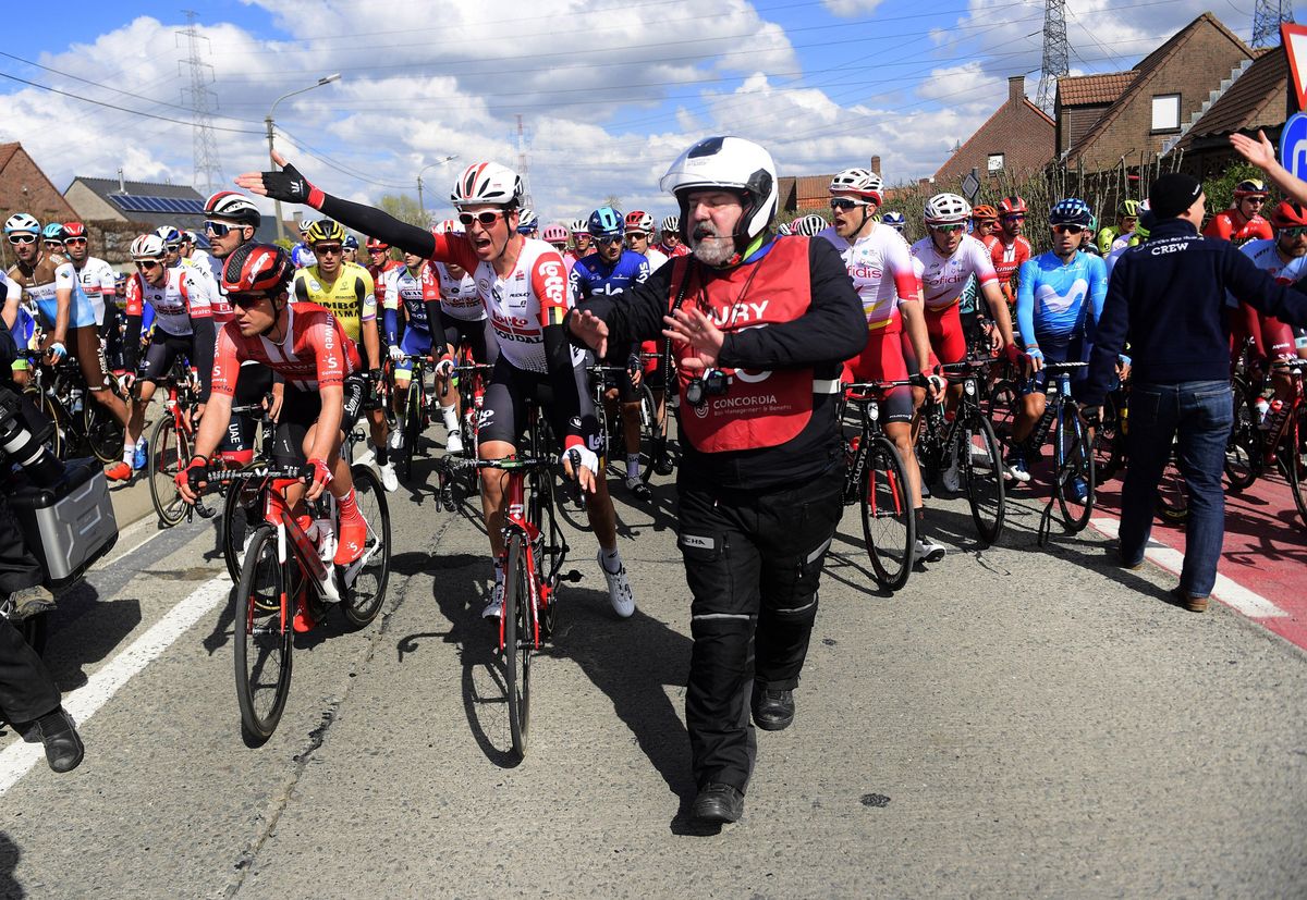 Lotto Soudal's Brian van Goethem reacts to the mayhem of the race being stopped just before the crux