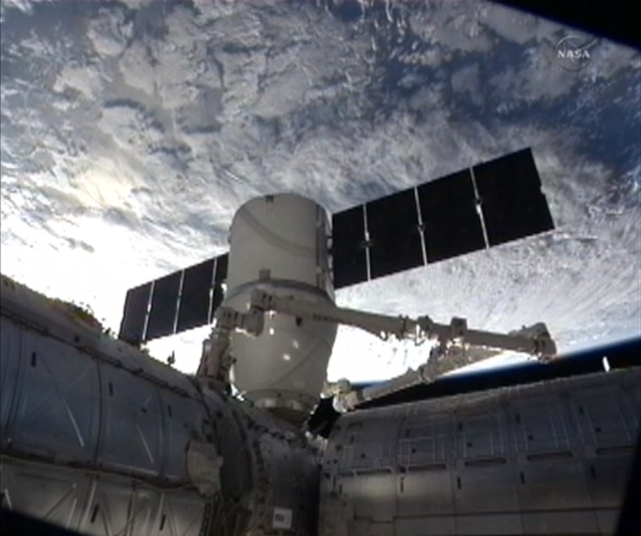 The SpaceX Dragon cargo capsule is seen with Earth in the background during docking at the International Space Station on March 3, 2013.