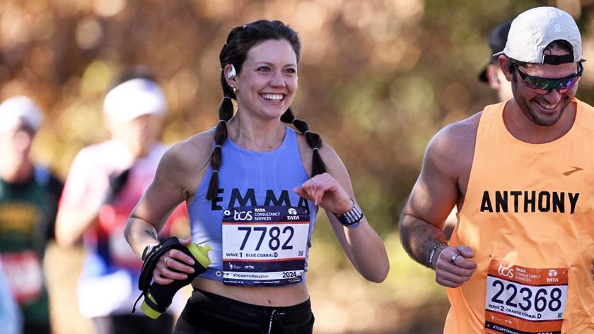 a woman running the nyc marathon