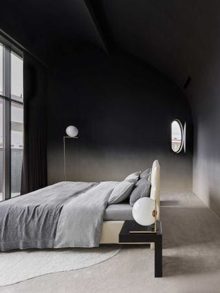a bedroom with a dark ombre wall