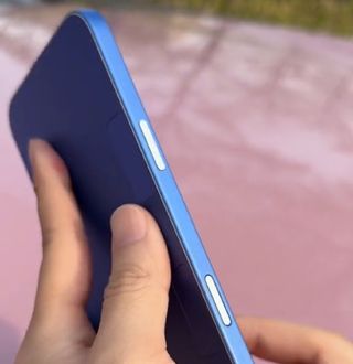 Alleged dummy of iPhone 16 or iPhone 16 Pro, from the side showing the power and capture buttons