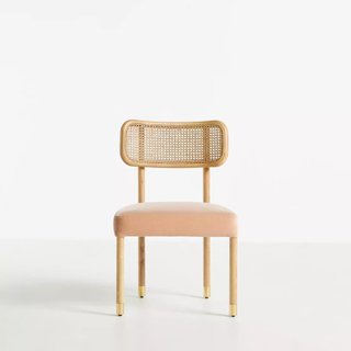 cane dining chair with blush pink cushion
