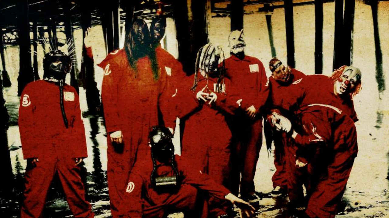 Slipknot posing for a photograph in masks and boiler suits in 1999