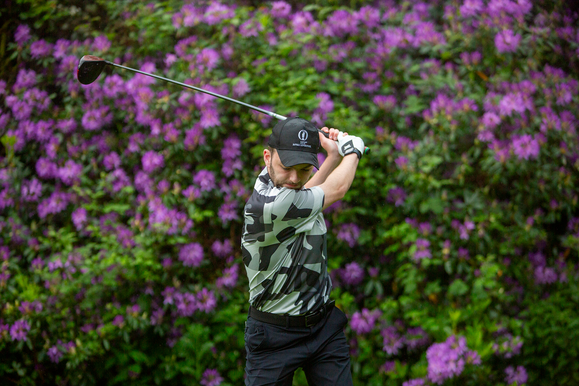 Dan Parker at the top of his backswing wit driver, making a strong and powerful turn to increase clubhead speed and maximise distance