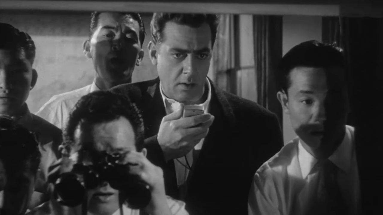 Raymond Burr reporting on a Godzilla attack IN Godzilla, King of the Monsters!