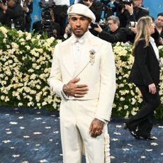 Lewis hamilton wears a full white look for the met gala.