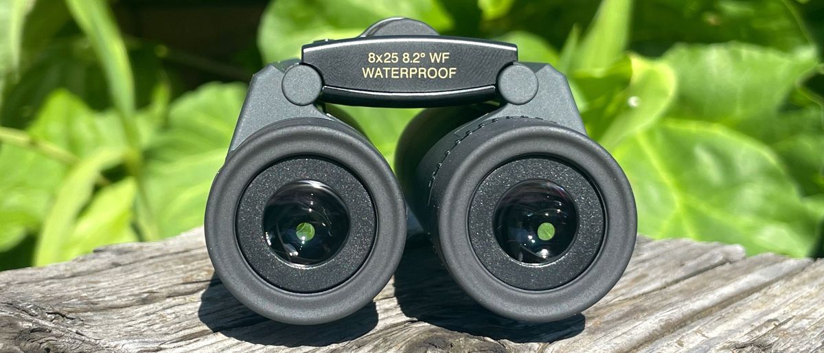 Nikon Trailblazer outside on a wooden table