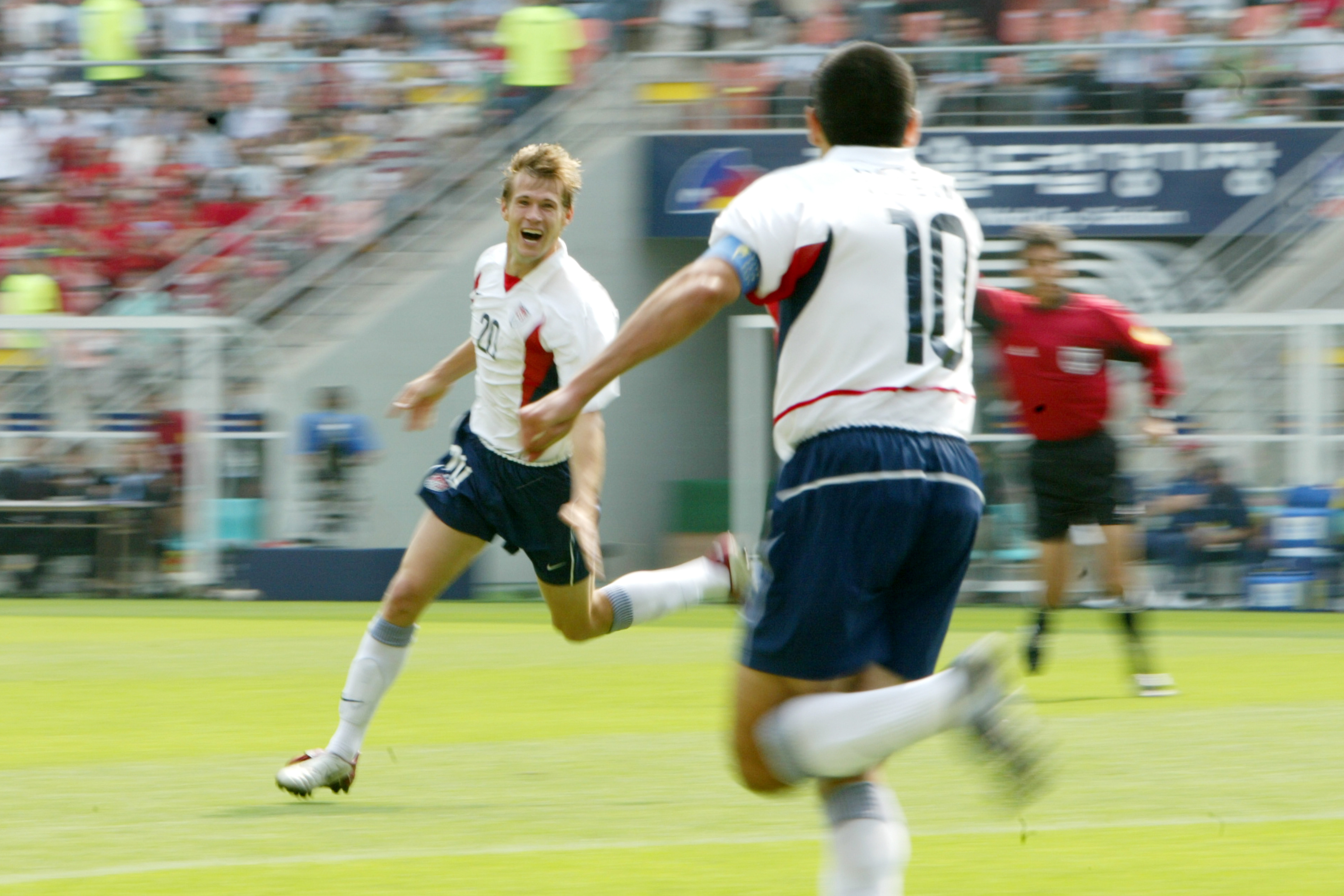 JEONJU, SOUTH KOREA - JUNE 17: Brian McBride of USA celebrates 0-1 with Claudio Reyna of USA during the World Cup match between Mexico v USA at the Jeonju World Cup Stadium on June 17, 2002 in Jeonju South Korea (Photo by Dale MacMillan/Soccrates/Getty Images)