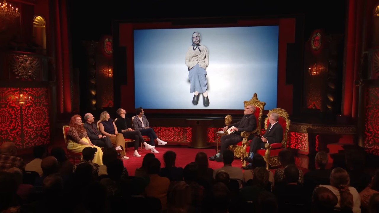 Joel Dommett, Alex Horne, Greg Davies, Joanna Page, Amy Gledhill, Armando Iannucci, and Kumail Nanjiani look up during Taskmaster Series 21.