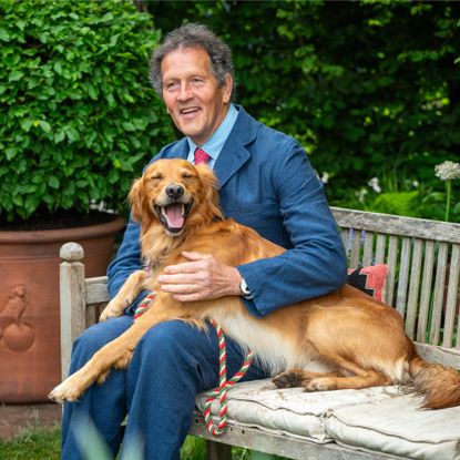 Monty Don on a bench with his dog