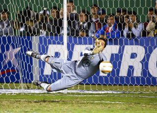 Julio Cesar saves a penalty for Brazil against Uruguay in the 2004 Copa America.