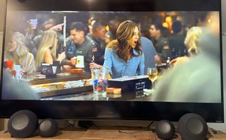 Two Echo Dot Maxes and echo studios in front of a tv