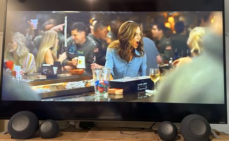 Two Echo Dot Maxes and echo studios in front of a tv