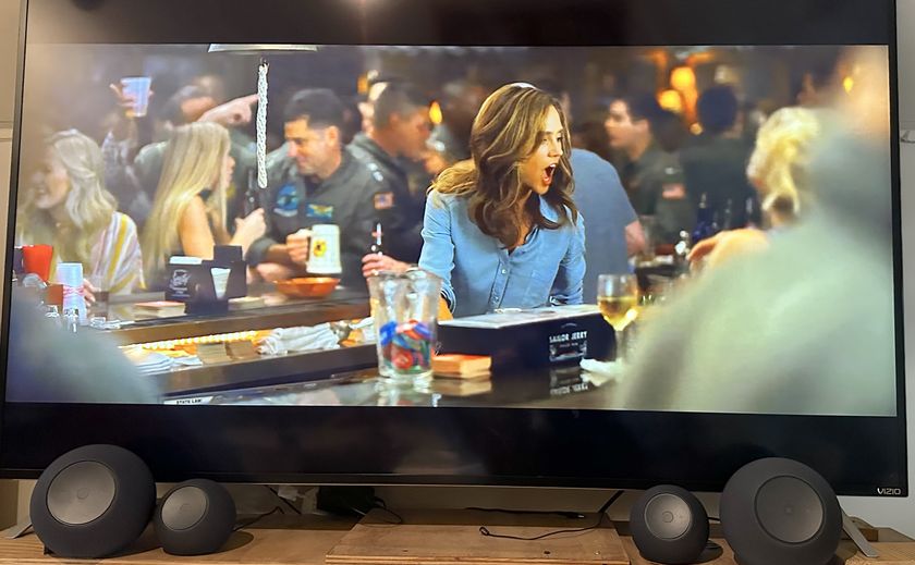 Two Echo Dot Maxes and echo studios in front of a tv