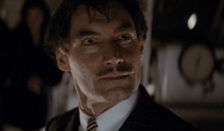 Neville Sinclair looking messy in the zeppelin in The Rocketeer.