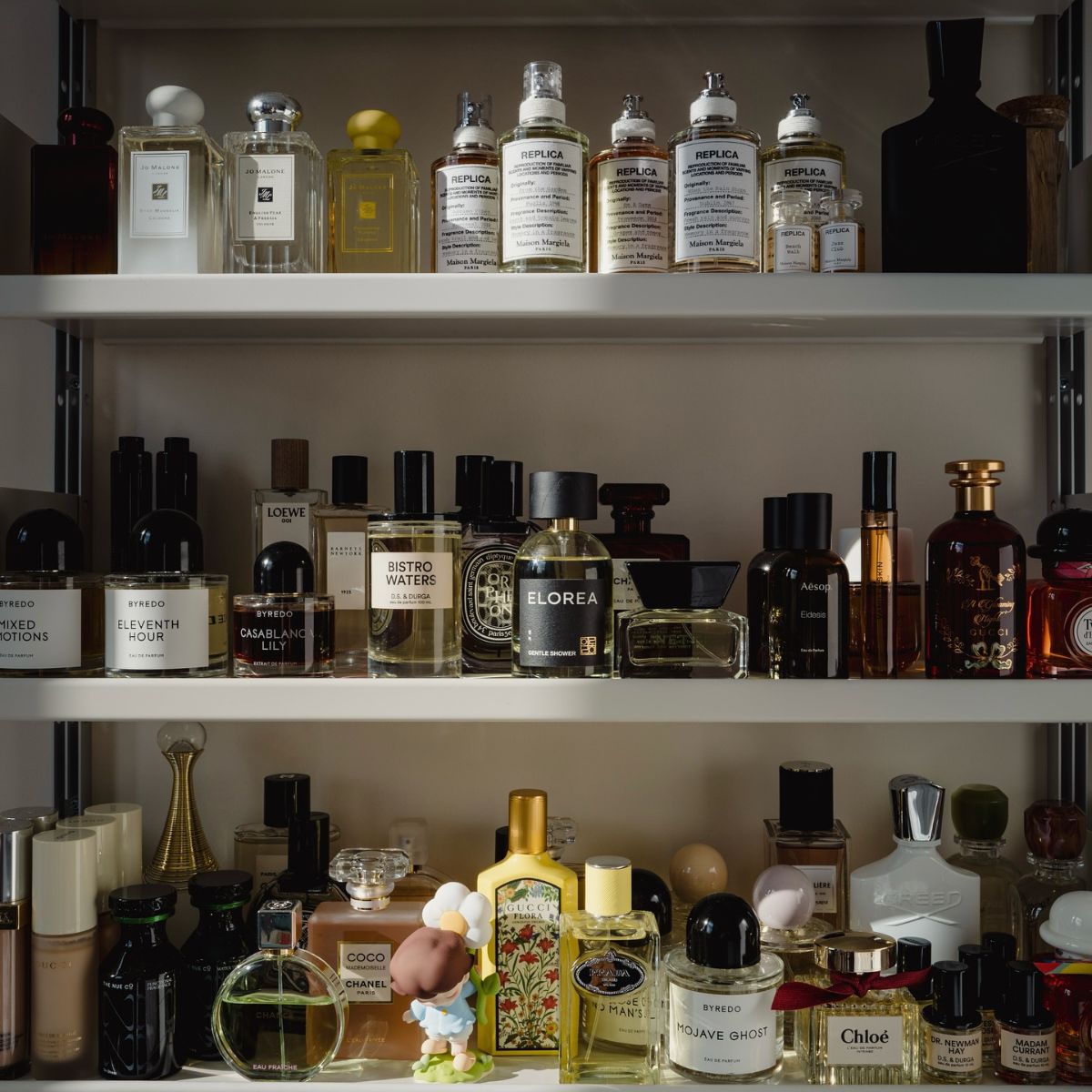 A medicine cabinet filled with perfume.