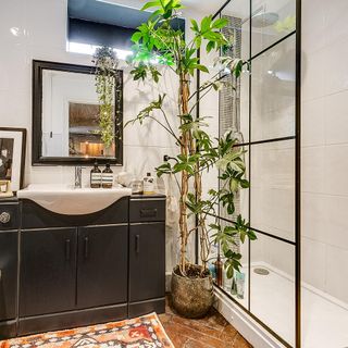 bathroom with tiles on wall and mirror