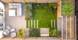 overhead shot of a small zoned garden showing how to make a small garden look bigger