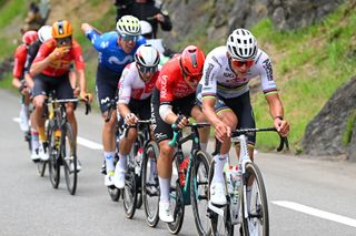 SAINTLARYSOULAN PLA DADET FRANCE JULY 13 LR Raul Garcia Pierna of Spain and Team Arkea BB Hotels and Mathieu van der Poel of Netherlands and Team Alpecin Deceuninck cduring the 111th Tour de France 2024 Stage 14 a 1519km stage from Pau to SaintLarySoulan Pla dAdet 1653m UCIWT on July 13 2024 in SaintLarySoulan Pla dAdet France Photo by Dario BelingheriGetty Images