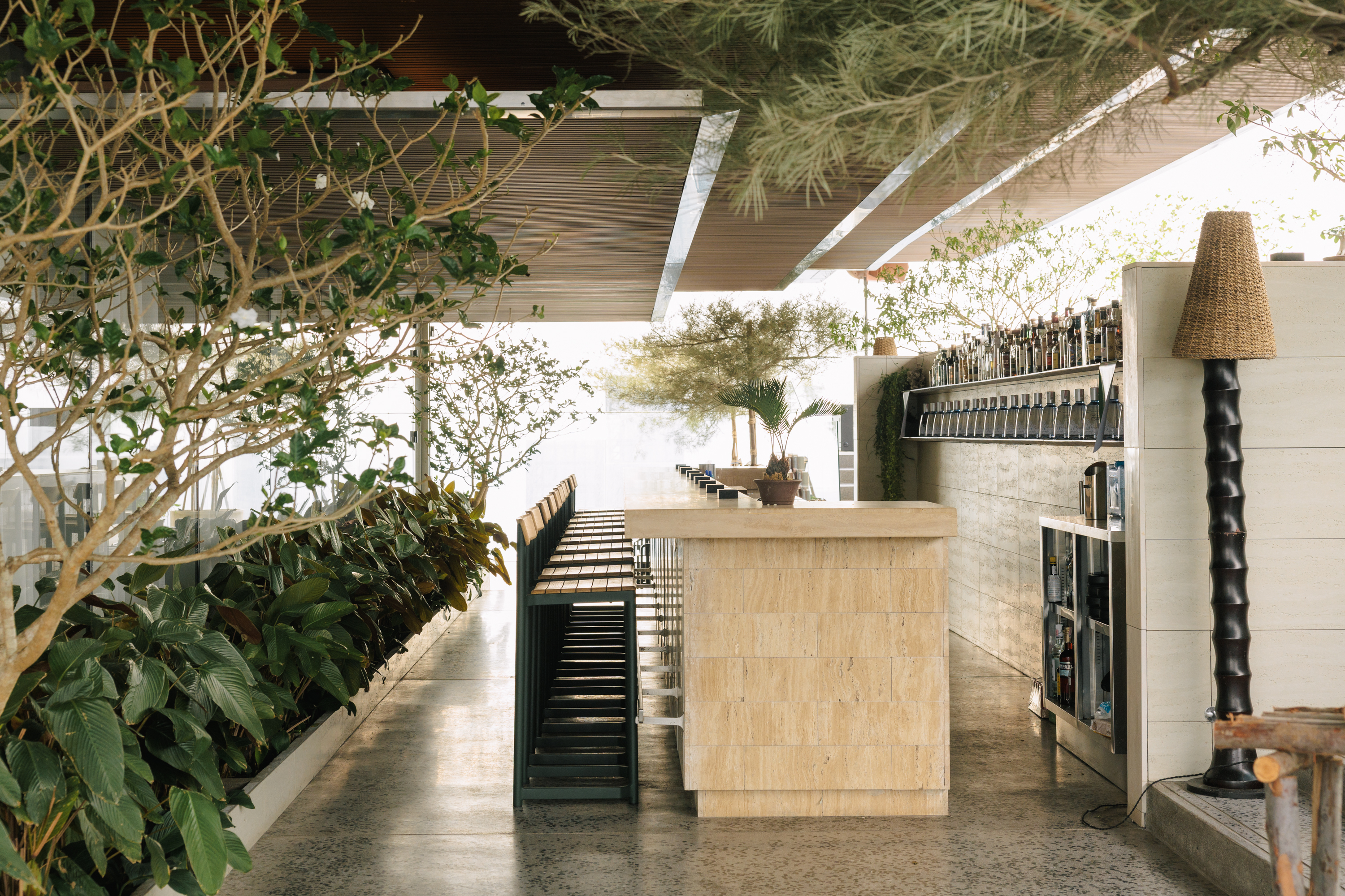 rooftop bar interior with warm wood and Fritz Hansen furniture