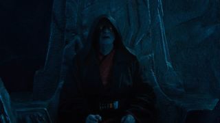 Ian McDiarmid sits in a dark and threatening chamber in Star Wars :The Rise of Skywalker.