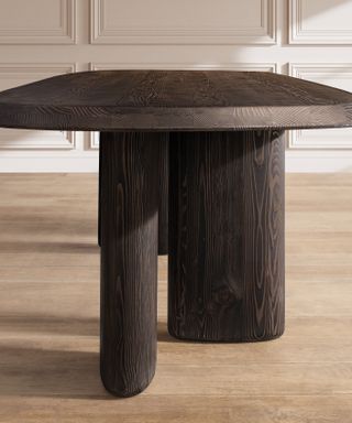 wooden table with asymmetrical legs by RH