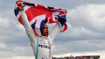 Mercedes driver Lewis Hamilton celebrates his win at the 2019 British Grand Prix