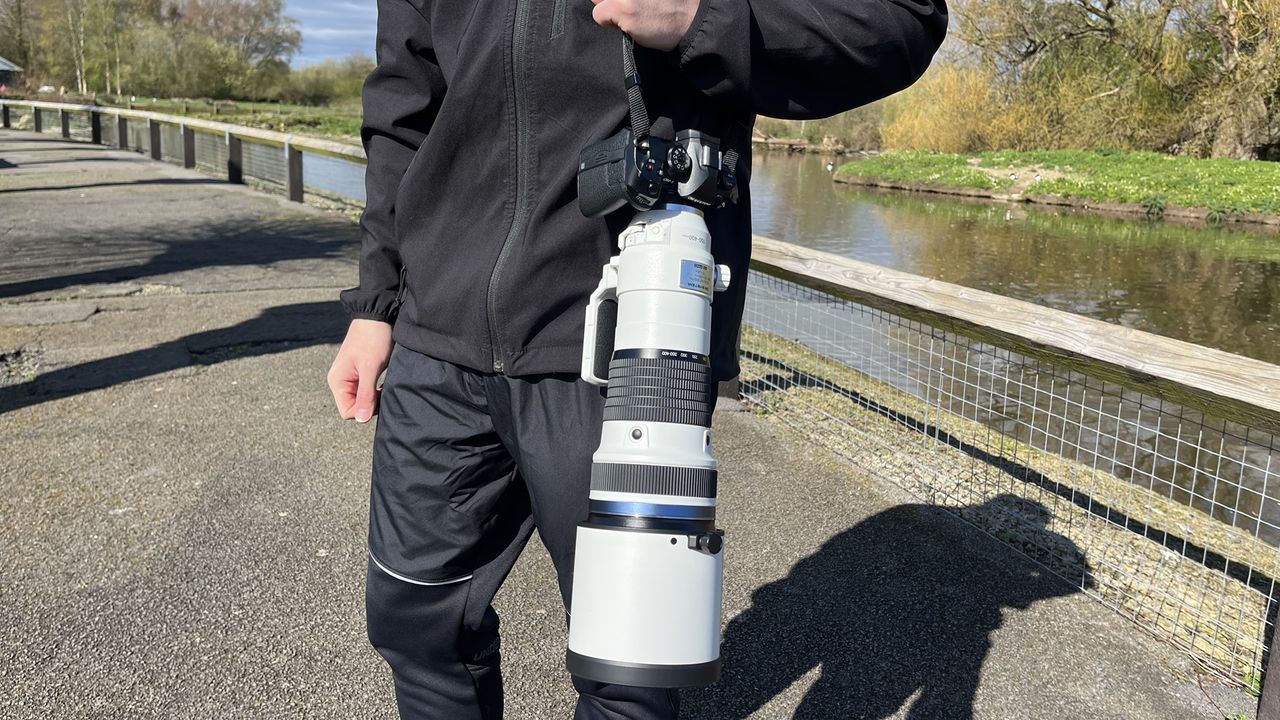 Mike Harris holding OM System M.Zuiko 150-400mm f/4.5 TC1.25x IS PRO at Slimbridge Wetland Centre