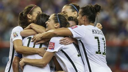 USA Women's Football team celebrating a goal