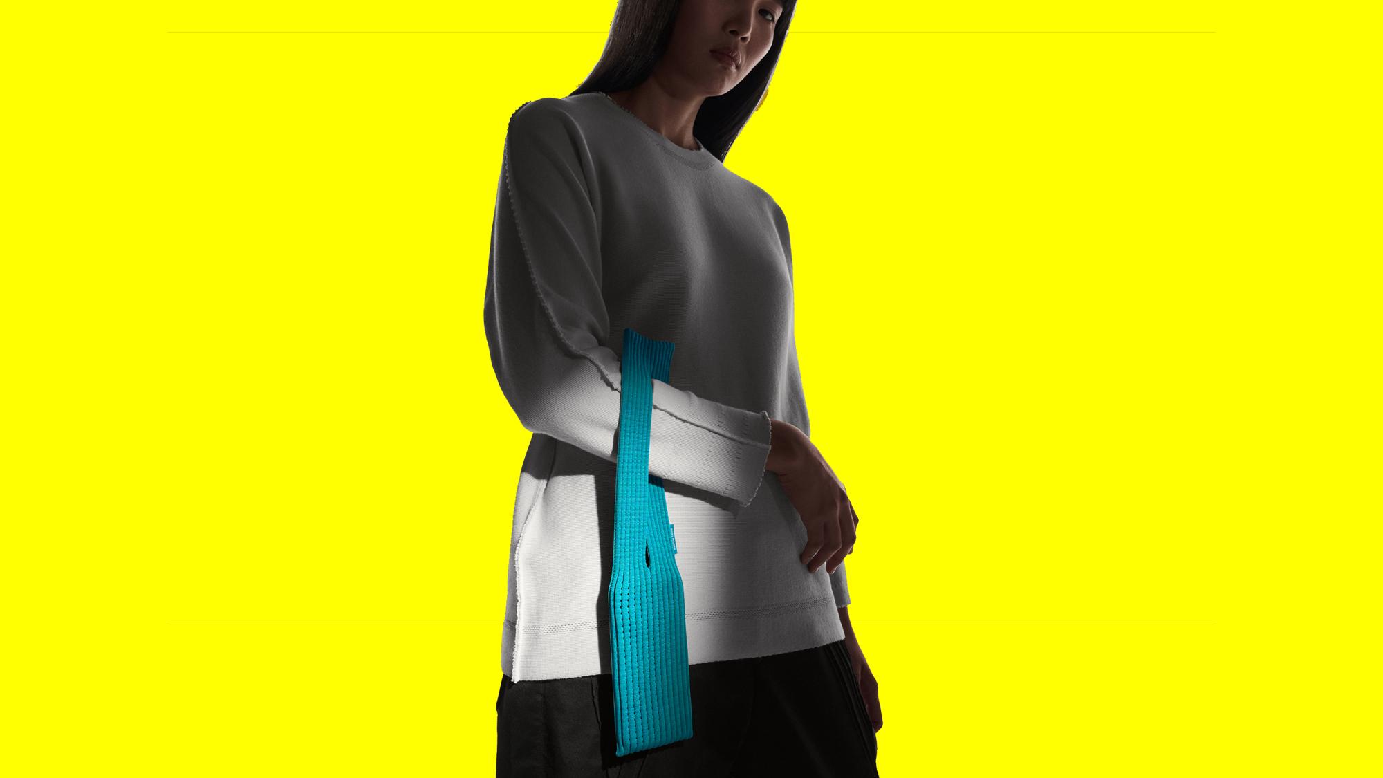 The iPhone Pocket accessory on a yellow background