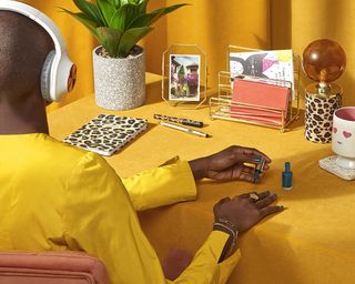 Yellow home office environment with headphones by Homesense