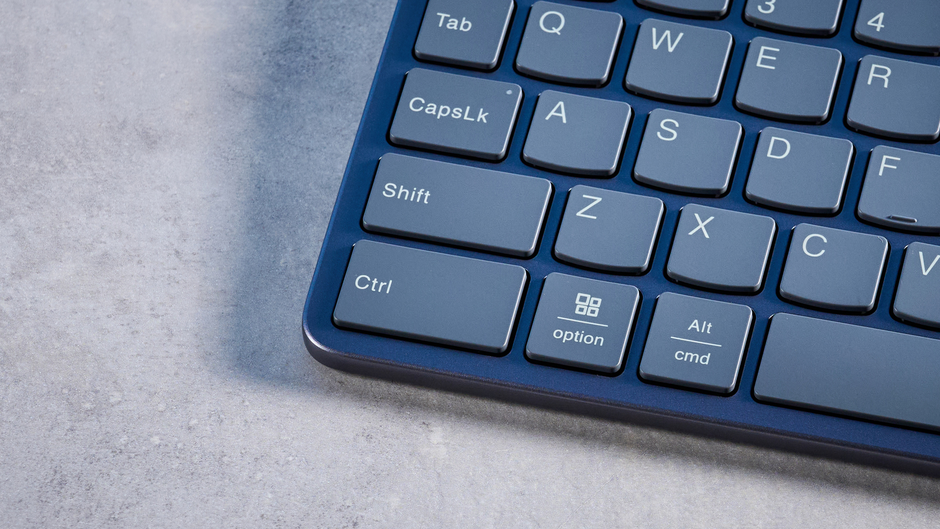 Lenovo Multi Device Keyboard photographed in front of a blue background.