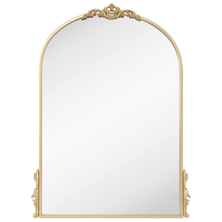 A gold ornate frame arch mirror
