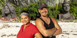 Survivor: Island of the Idols Sandra and Boston Rob in front of statues CBS