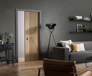 Grooved pocket door sliding into the wall of a living room