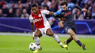 Khvicha Kvaratskhelia of SSC Napoli and Jurrien Timber of AFC Ajax Battles for the ball