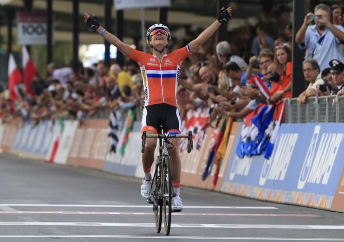 Marianne Vos (Netherlands) wins the road race world championship for the second straight year and third time of her career.