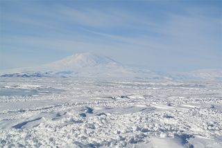 The ice-heavy environment at McMurdo Station in Antarctica is similar to what could be found on Europa. The mountain in the background of this image is Mt. Erebus.