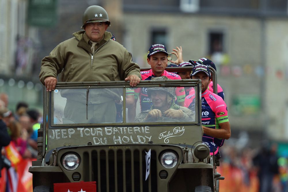 Lampre-Merida riders are driven in a jeep