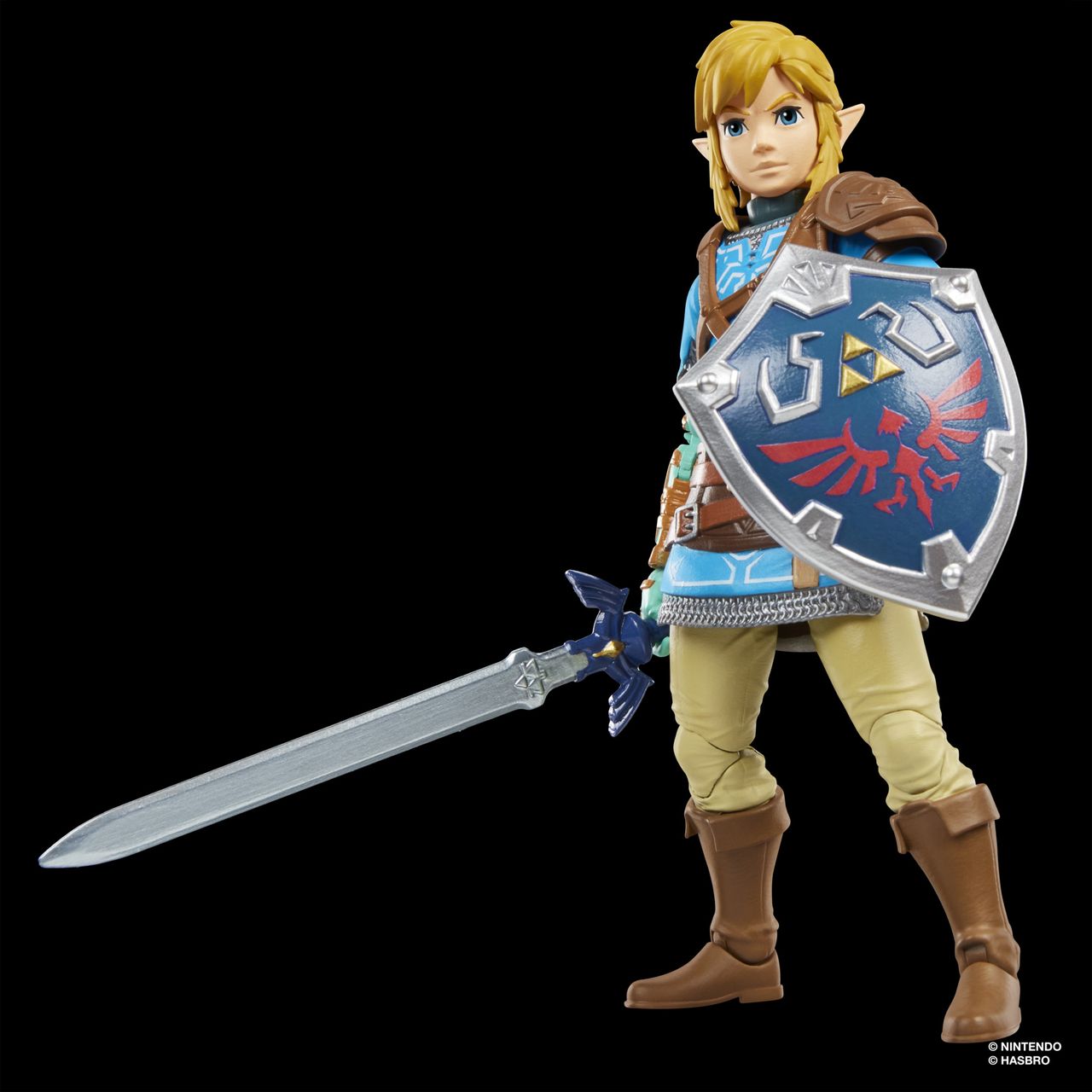 An action figure of Link from Tears of the Kingdom stands against a dark background