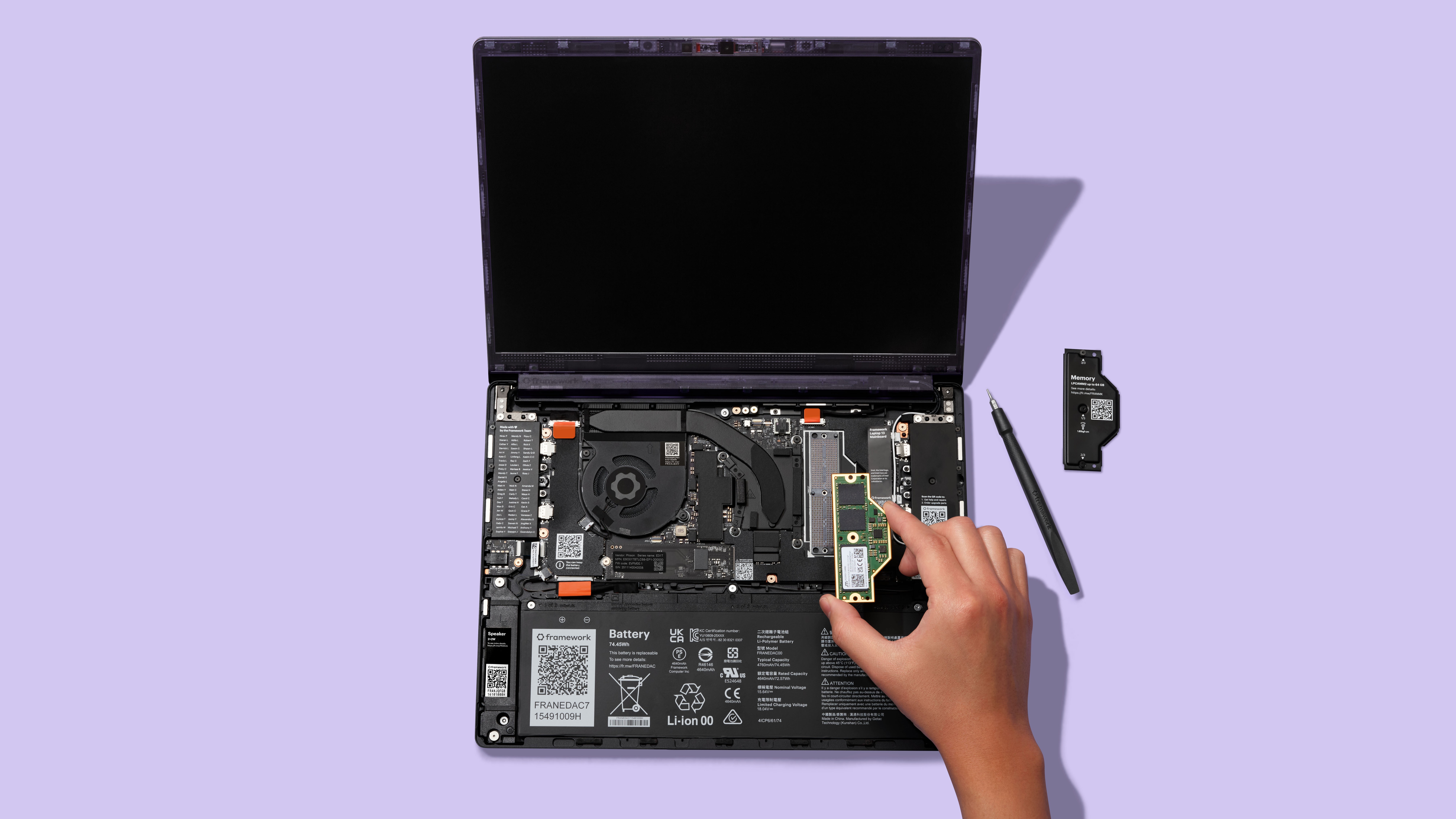 A person installing RAM in the new Framework Laptop 13 Pro