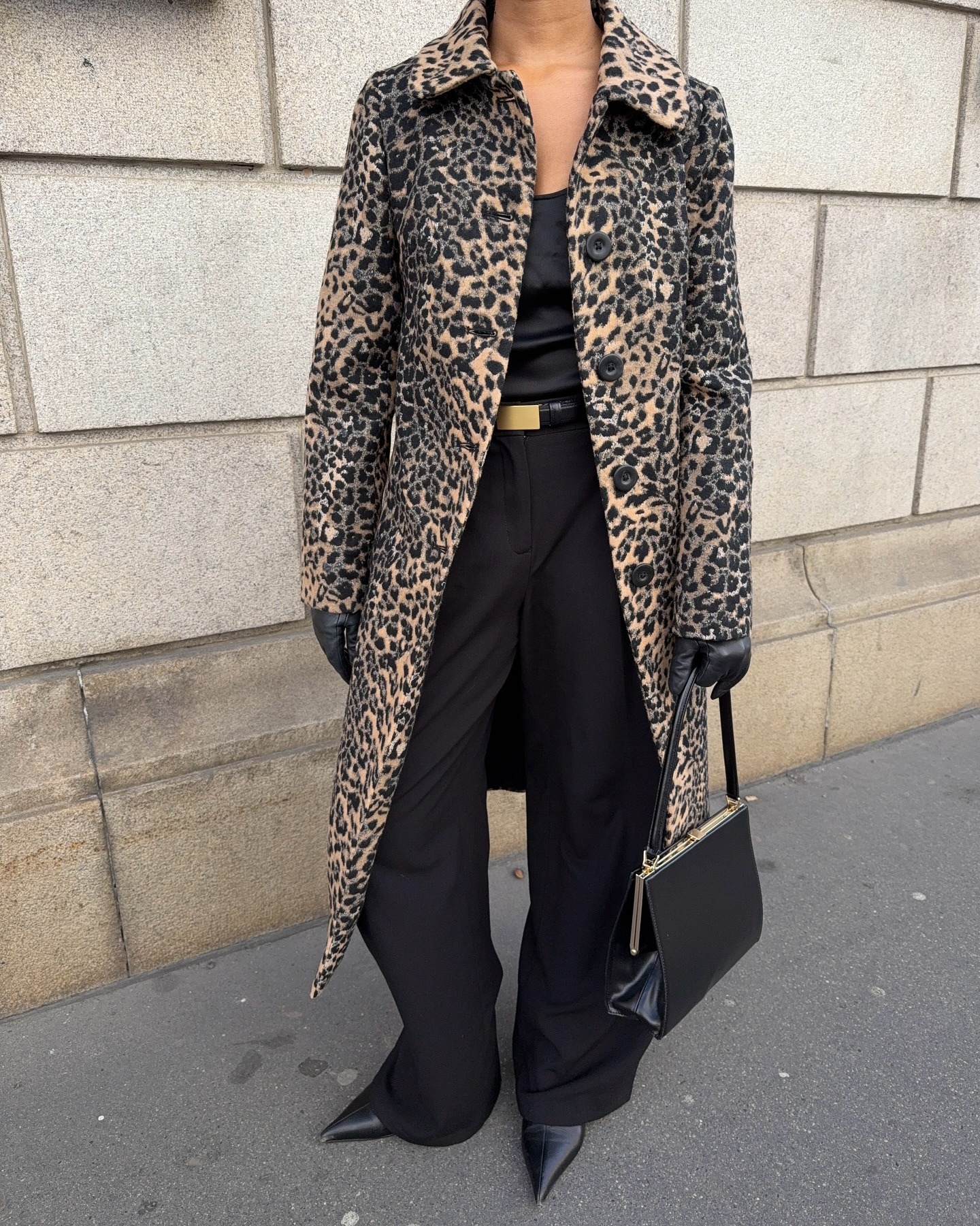 Woman in leopard print coat and black outfit