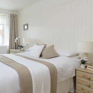 Neutral bedroom with wall panelling
