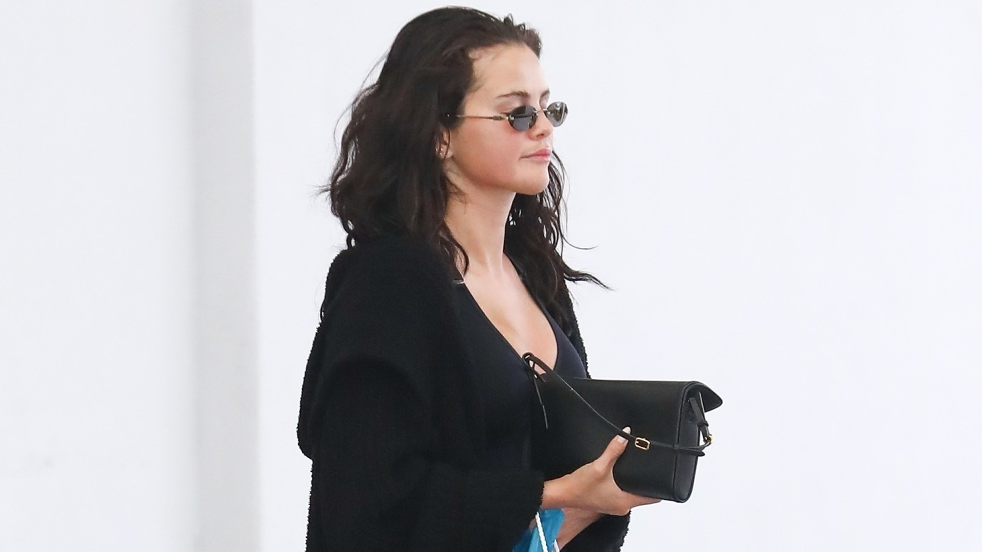 Selena Gomez wore all-black loungewear with a backless pair of Mary Janes