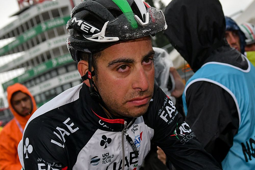Fabio Aru (UAE Team Emirates) rolls through the finish line, cold and wet, after stage 12 of the Giro d'Italia