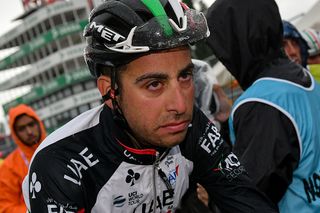 Fabio Aru (UAE Team Emirates) rolls through the finish line, cold and wet, after stage 12 of the Giro d'Italia