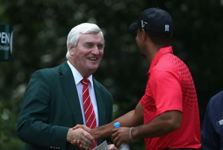 Open Announcer Ivor Robson shakes hands with Tiger Woods on the first tee during the final round of the 141st Open Championship at Royal Lytham & St. Annes Golf Club