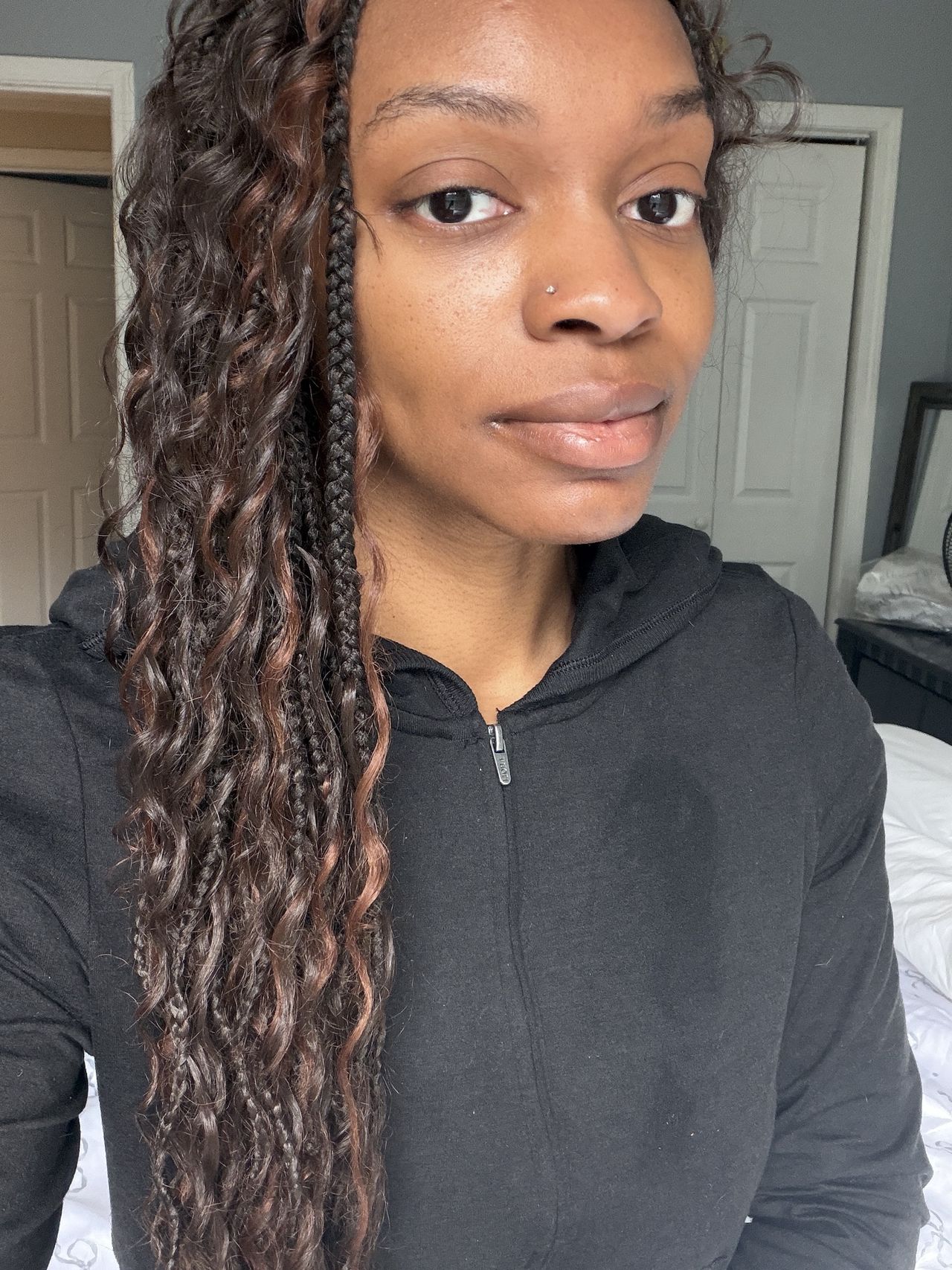 a before image of a woman testing a black liquid eyeliner