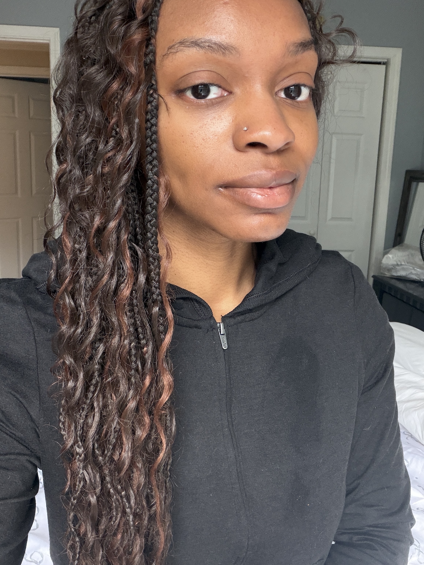 a before image of a woman testing a black liquid eyeliner